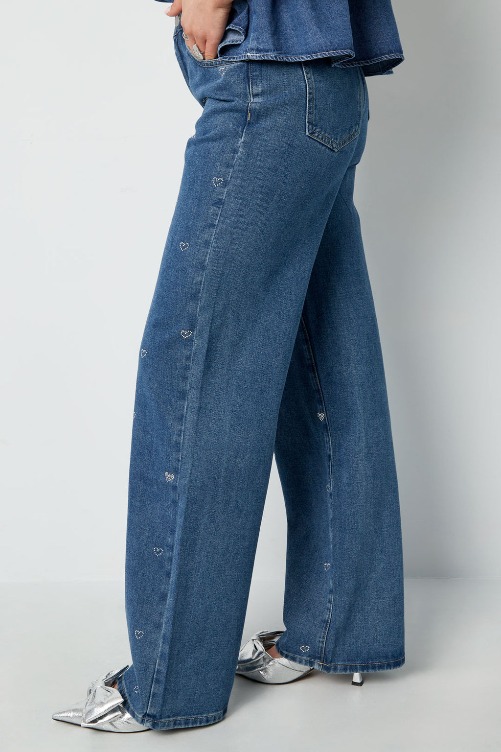 Jeans denim con cuore glitterato